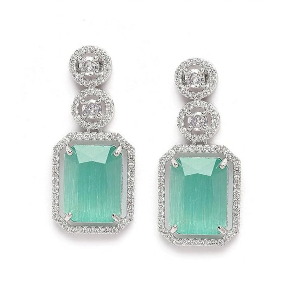 Women's turquoise brass silver plated drop earrings on display, jewelry accessories for special occasions