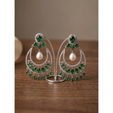 Green brass silver plated chandbali earrings for women, intricate design on display