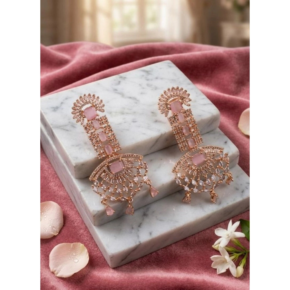 Women's pink brass silver plated drop earrings, delicate jewelry accessory on display