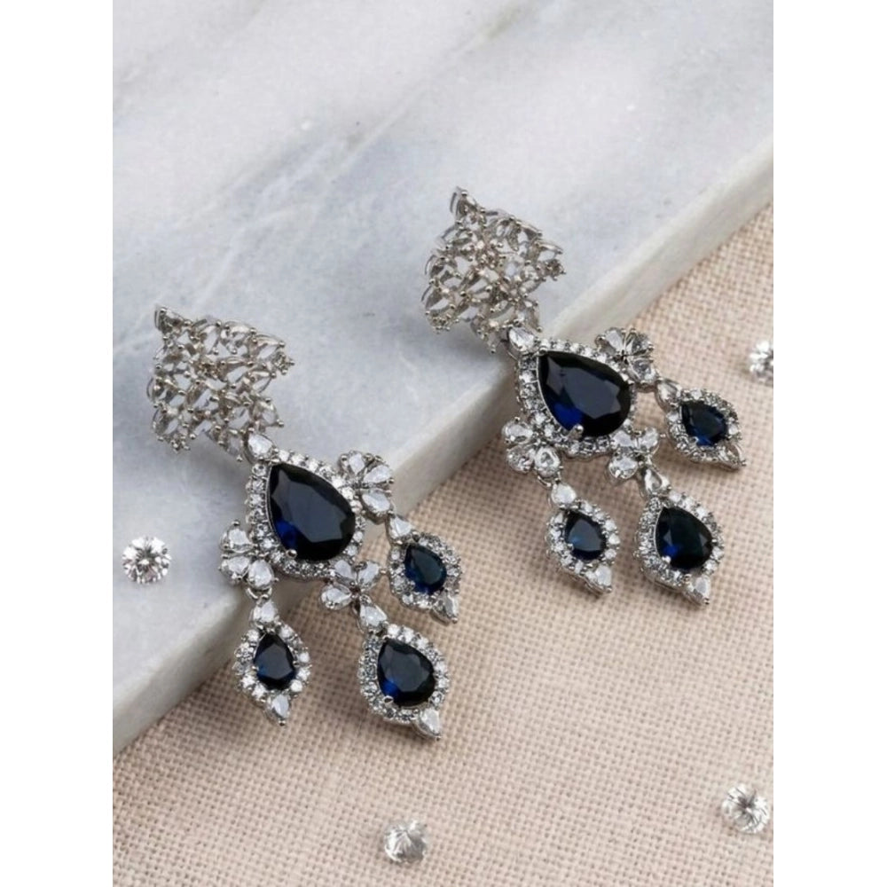 Women's brass silver plated blue drop earrings, elegant jewelry accessory on display