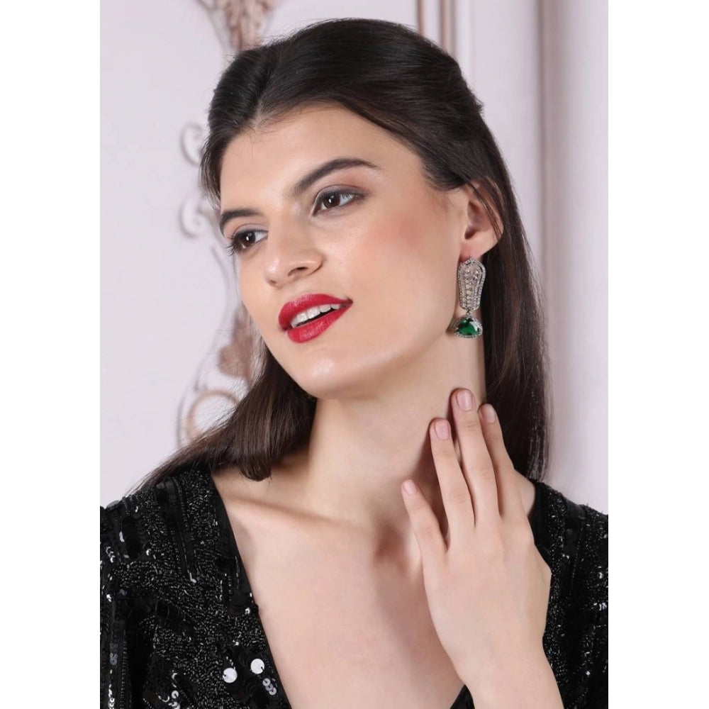 Green brass silver plated earrings, women's drop style jewelry accessory on display