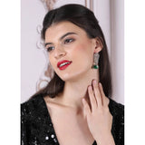 Green brass silver plated earrings, women's drop style jewelry accessory on display