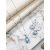 Blue brass silver plated pendant set for women, elegant jewelry accessory on display