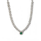 Green brass silver plated necklace set for women, elegant accessory on display stand