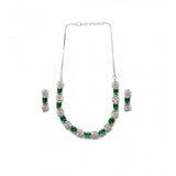 Green brass silver plated necklace set for women, delicate jewelry on display stand