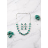 Green brass silver-plated women's necklace set, elegant jewelry accessory on display