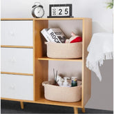 Beige cotton 2-piece oval storage baskets (10x7x4 inches), ideal for organizing clothes & kids toys in bathroom, kitchen, or living room