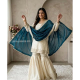 Cream & Teal silk embroidered v-neck kurti set with sharara pant and dupatta, intricate detailing on traditional Indian attire