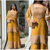 Yellow silk embroidered round kurti set with sharara pant and dupatta, intricate pattern detail