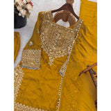Yellow silk embroidered 3/4th sleeve round kurti with sharara pant and dupatta set, intricate design on traditional Indian attire