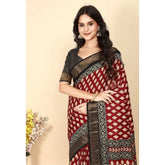 Red cotton silk printed saree with unstitched blouse, vibrant Indian traditional wear on mannequin