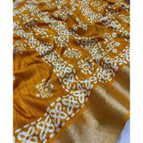 Yellow cotton silk printed saree with unstitched blouse, vibrant floral pattern on display