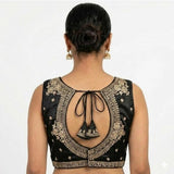 Black silk embroidered V-neck sleeveless padded blouse (size 38), hook closure on display