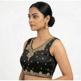 Black silk embroidered V-neck sleeveless padded blouse for women with hook closure on display