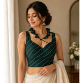 Green silk embellished sweetheart neck, sleeveless padded blouse for women on mannequin