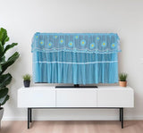 Blue seamless hanging TV cover with tempered glass window to protect electronics from dust and scratches