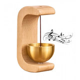 { "alt_text": "Gold magnetic doorbell with natural wooden base, adhesive door chime for home entrance or garden gate" }