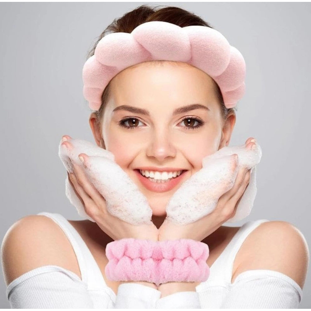 { "alt_text": "Pink elastic spa headband wristband set, absorbent beauty routine accessories for skincare and makeup" }