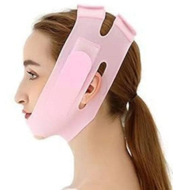 Pink silicone V-line lifting face mask for slimming and jawline shaping, adjustable and reusable for men and women
