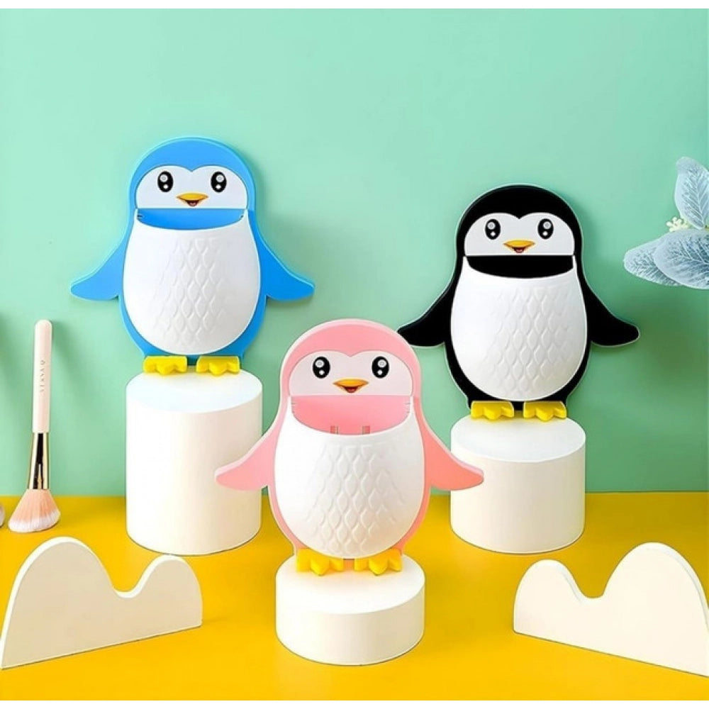 { "alt_text": "Multicolor plastic toothbrush holder set of 3, penguin design bathroom organizer for countertop storage" }