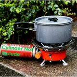 Orange windproof lotus stove for camping & trekking; foldable, lightweight, compact design with carry bag