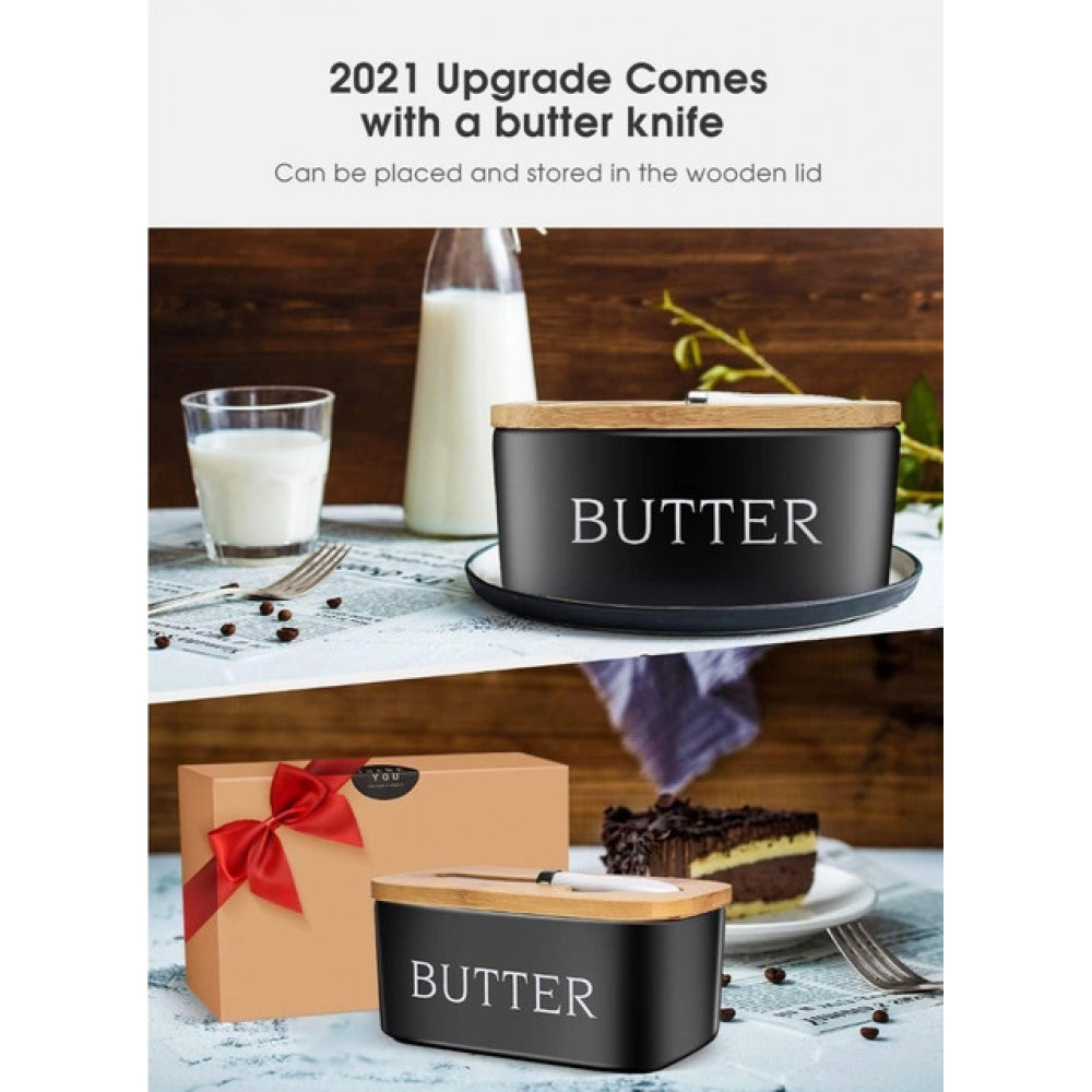 { "alt_text": "Black ceramic butter box with bamboo lid, airtight storage container for fresh butter, kitchen countertop accessory" }