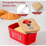{ "alt_text": "Red ceramic butter box with bamboo lid, airtight storage container for fresh butter, kitchen countertop accessory" }
