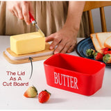 { "alt_text": "Red ceramic butter box with bamboo lid, airtight storage container for fresh butter, kitchen countertop accessory" }