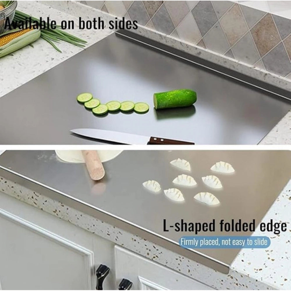 { "alt_text": "Silver stainless steel chopping board for kitchen prep, durable food preparation tool with built-in lip" }