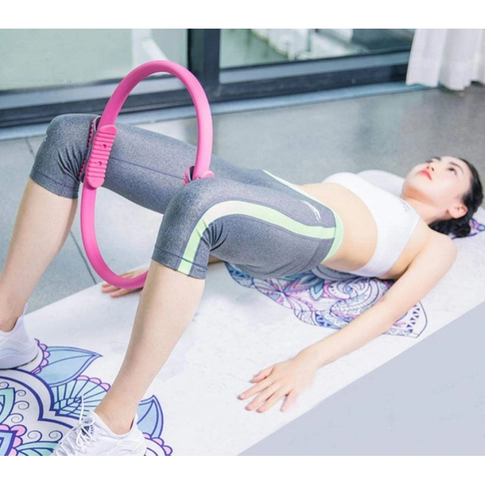 { "alt_text": "Pink rubber yoga pilates ring for core workout, abdominal, and thigh toning exercise equipment" }
