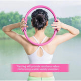 { "alt_text": "Pink rubber yoga pilates ring for core workout, abdominal, and thigh toning exercise equipment" }