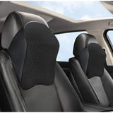 { "alt_text": "Black memory foam car headrest pillow for neck support, pain relief, and comfortable travel on long drives" }