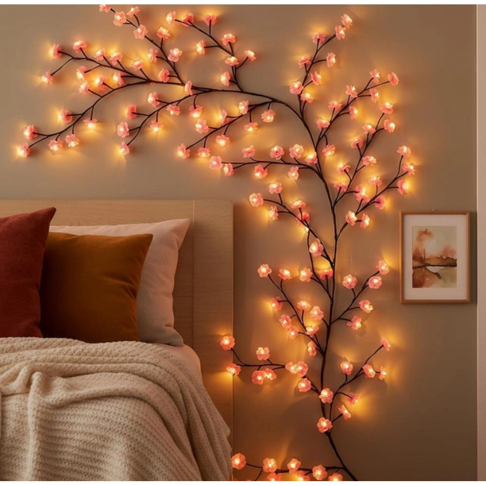 { "alt_text": "Multicolor LED vine light, bendable floral wall decor, warm yellow pink glow for bedroom mood lighting" }