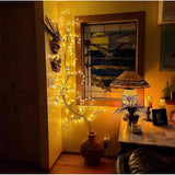 Yellow willow vine light: Bendable, tree branch layout with evenly spaced LED blossoms for cozy bedroom mood lighting. USB powered design with remote control