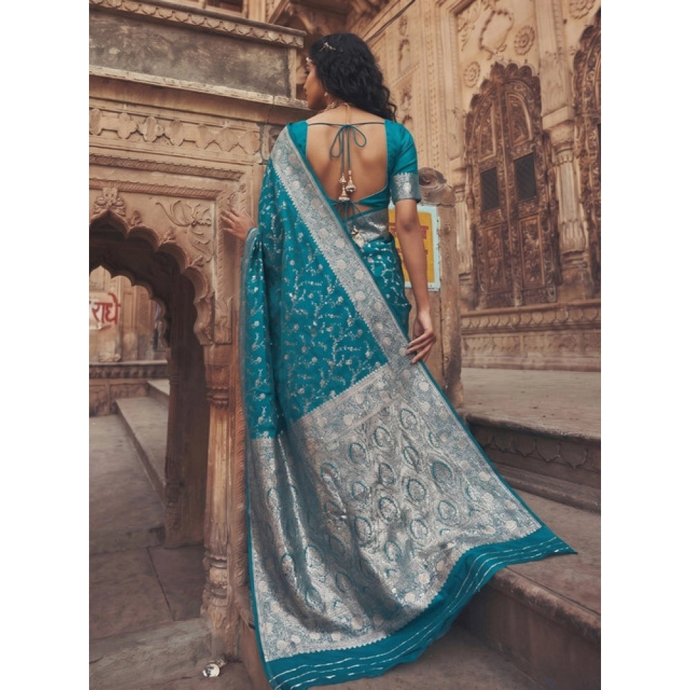 { "alt_text": "Teal art silk printed saree with unstitched blouse, 5.5m, ethnic wear, Indian traditional clothing" }