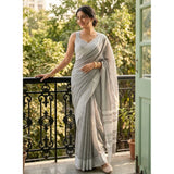 { "alt_text": "Gray linen striped saree with unstitched blouse, 5.5m linen fabric, traditional Indian ethnic wear" }