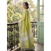 { "alt_text": "Light green linen striped saree with unstitched blouse, 5.5m linen ethnic wear for women" }