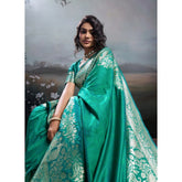 { "alt_text": "Teal green silk blend printed saree with unstitched blouse, 5.5Mtr ethnic wear, Indian traditional clothing" }