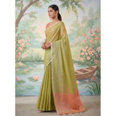 { "alt_text": "Green tissue silk saree with unstitched blouse, solid design, 5.5 meter ethnic wear for women" }