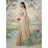 { "alt_text": "Beige tissue silk saree with unstitched blouse, solid women's ethnic wear, 5.5 meter saree fabric" }