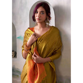 { "alt_text": "Mustard tissue silk saree with unstitched blouse, solid color, 5.5 meter ethnic wear for women" }
