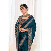{ "alt_text": "Teal crepe printed saree with unstitched blouse, 5.5m, ethnic wear, Indian fashion, traditional drape" }