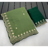{ "alt_text": "Green georgette embroidered saree with unstitched blouse, star print ethnic wear, 5.5 meter Indian clothing" }