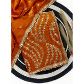 { "alt_text": "Orange satin embellished saree with unstitched blouse, 5.5m, traditional Indian ethnic wear" }