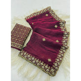 { "alt_text": "Wine-toned satin embellished saree with unstitched blouse, 5.5m, ethnic wear, wedding attire" }