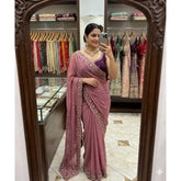 { "alt_text": "Pink georgette embroidered saree with unstitched blouse, star print ethnic wear, 5.5 meter Indian clothing" }