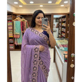 { "alt_text": "Purple georgette embroidered saree with unstitched blouse, star print ethnic wear, 5.5 meter Indian clothing" }