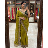 { "alt_text": "Olive green georgette saree with embroidery, star pattern, unstitched blouse, 5.5 meter ethnic wear" }