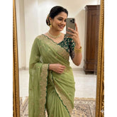 { "alt_text": "Green georgette embroidered saree with unstitched blouse, star print ethnic wear, 5.5 meter Indian clothing" }