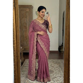 { "alt_text": "Pink georgette embroidered saree with unstitched blouse, star print ethnic wear, 5.5 meter Indian clothing" }